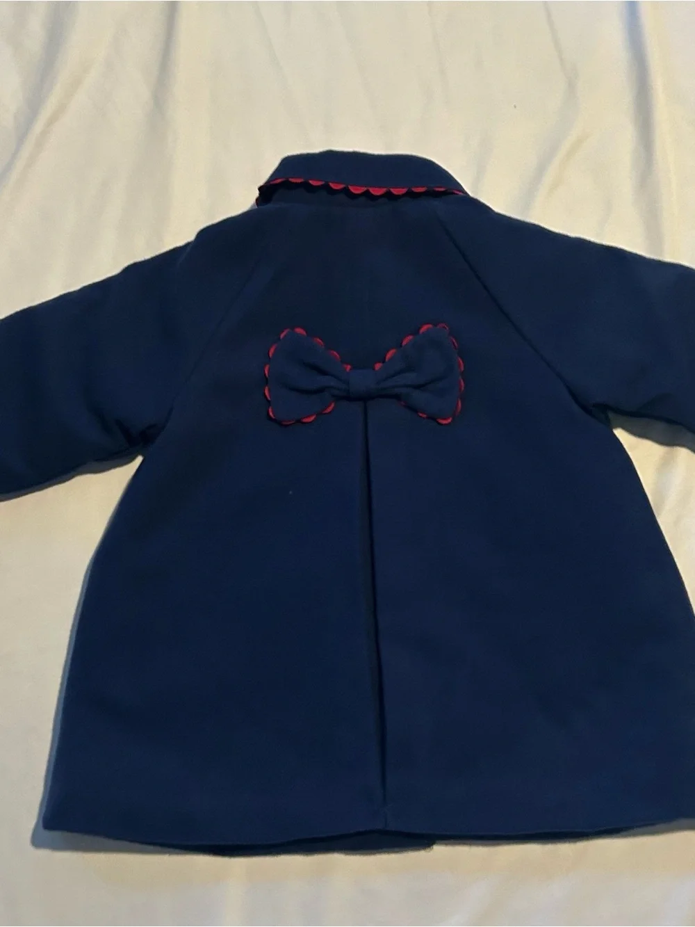 Little Me Navy Pea Coat with Red Scallop Trim and Bow.